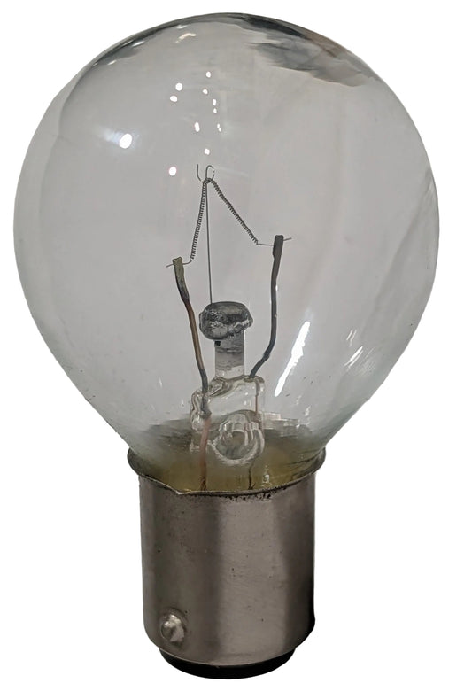 A clear glass light bulb with a silver metal bayonet base, showing the internal filament structure against a plain light background.